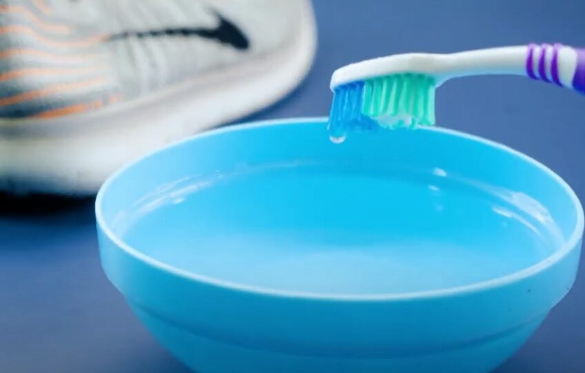detergent to a toothbrush